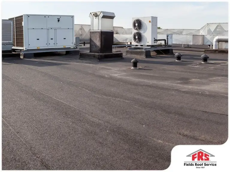 Flat commercial roof with HVAC units