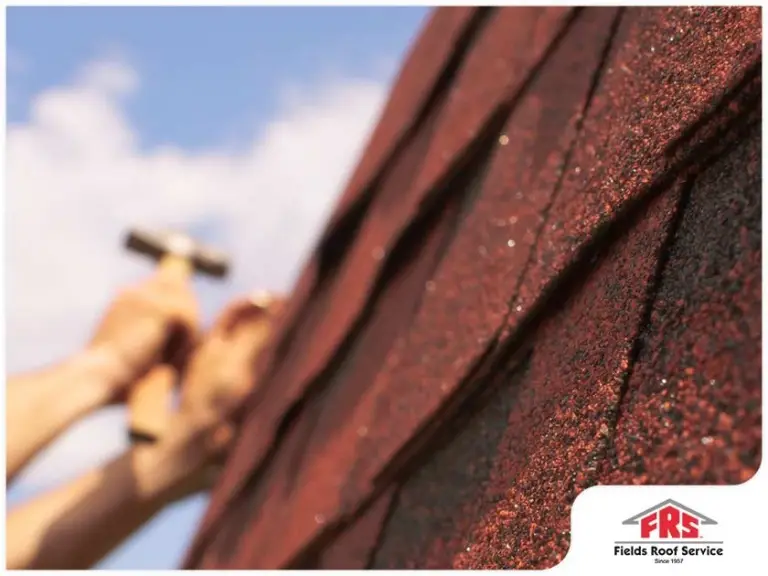 Close-up of roofing shingles being installed