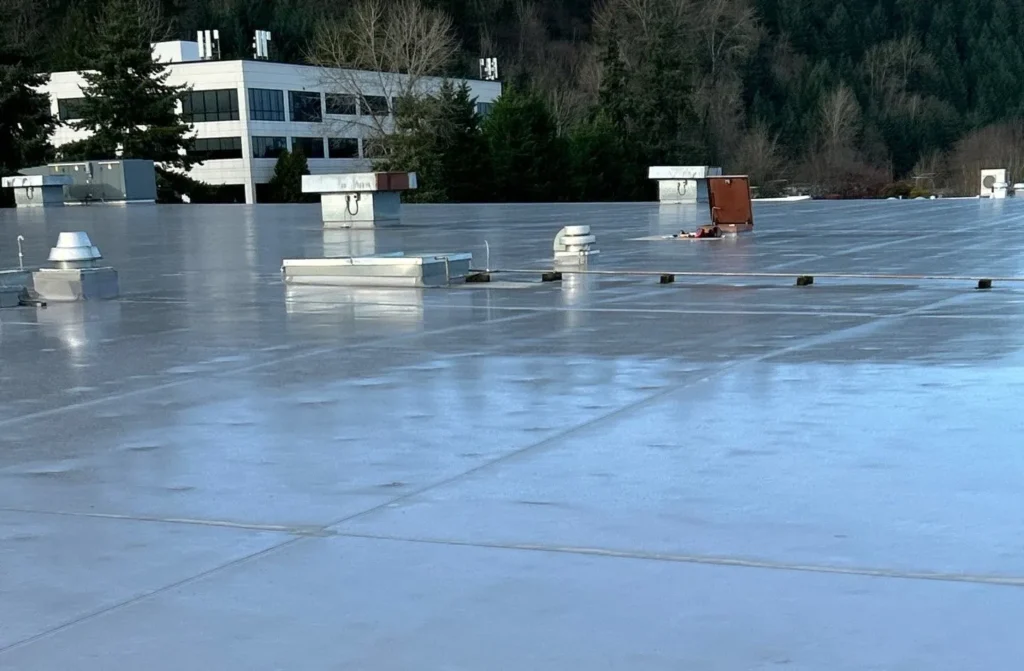 Flat commercial roof with equipment visible