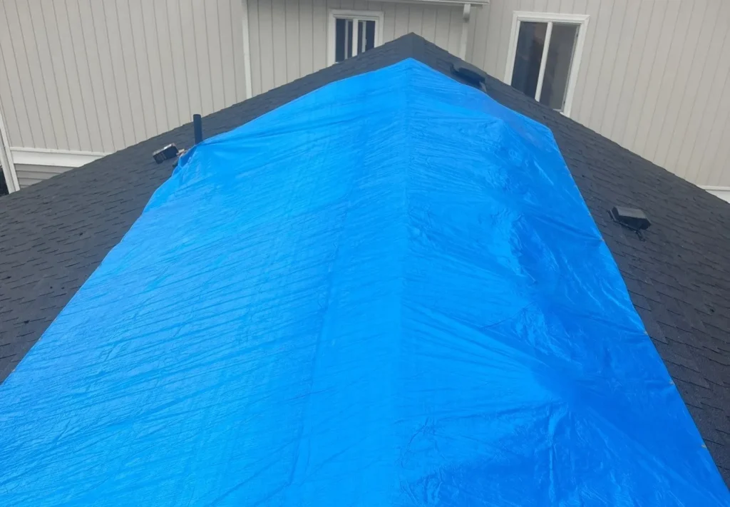 Blue tarp covering a roof